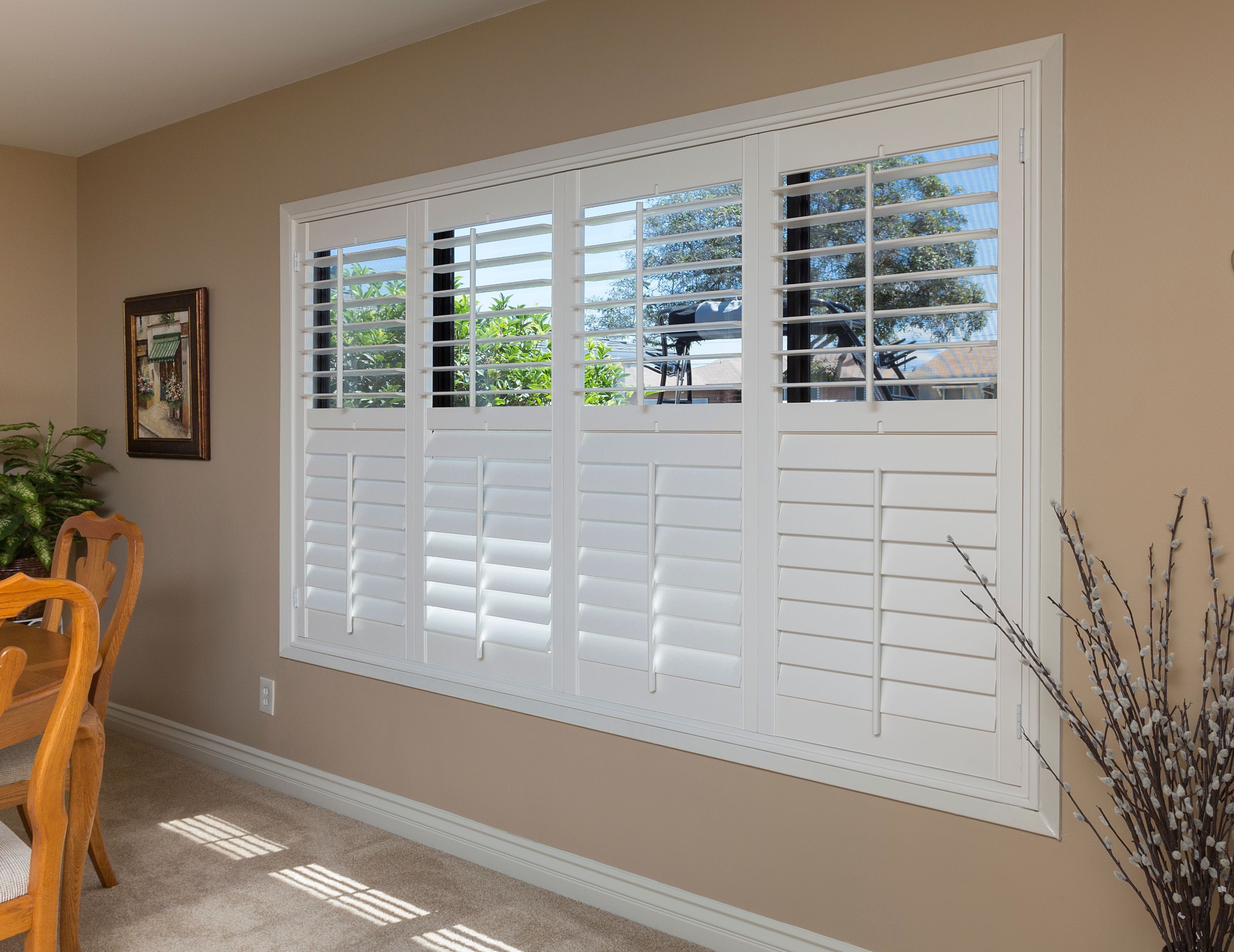 Four White Window Shutters With Open Upper Parts