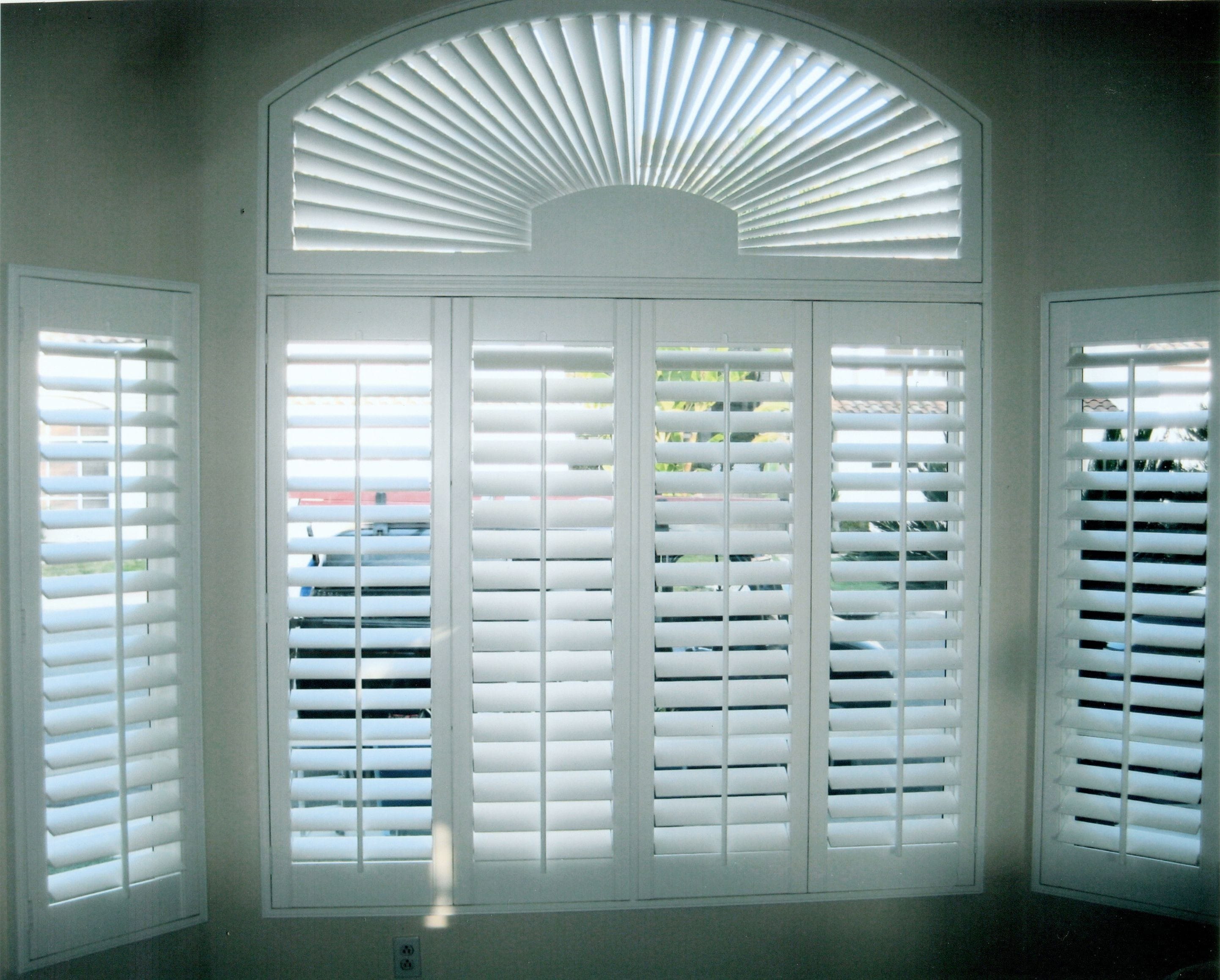 White Window Shutter Panels With Arch Panel In The Top